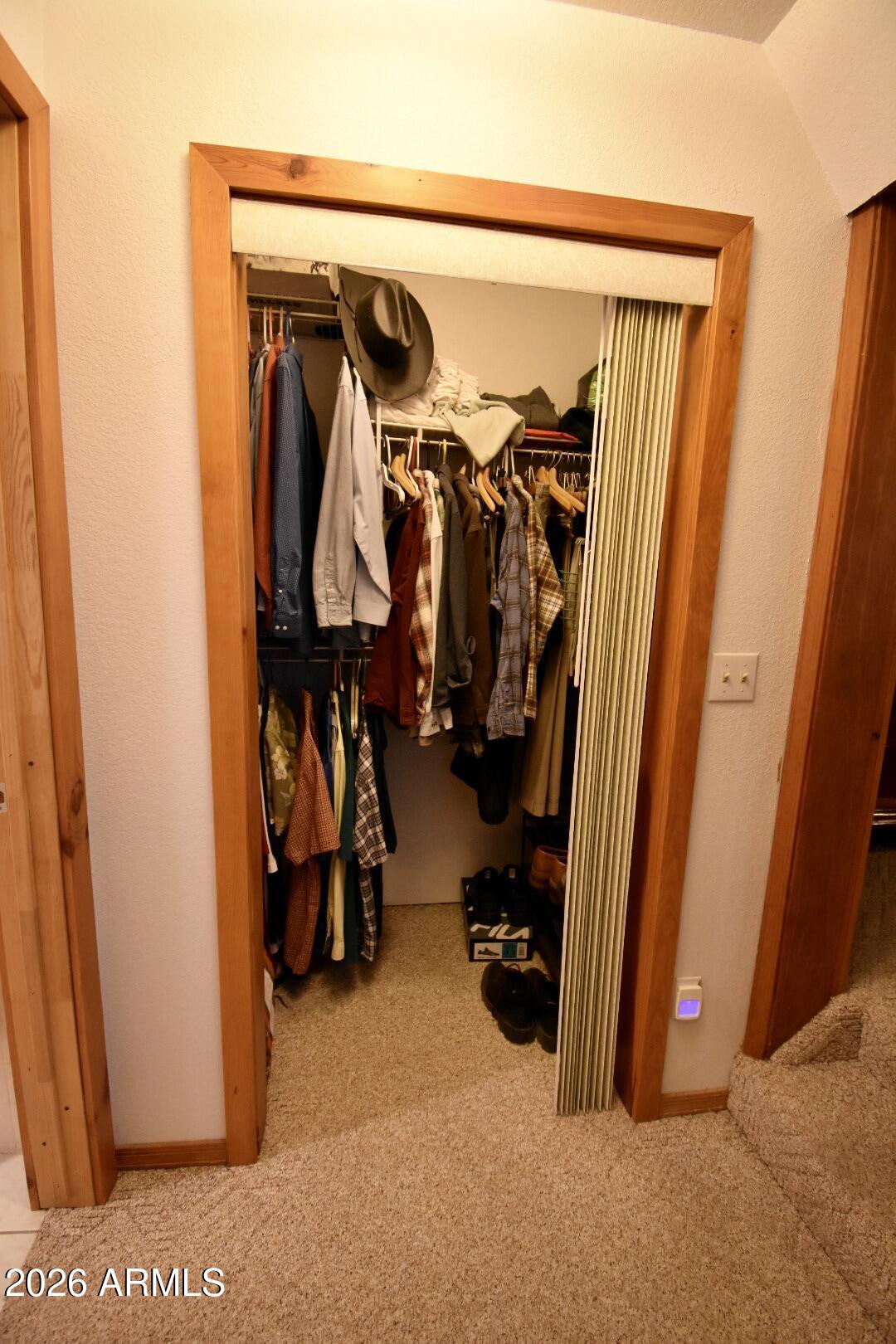 4310 North Lake View Drive Rimrock, AZ 86335 - Photo 17 of 43 a view of walk in closet with clothes