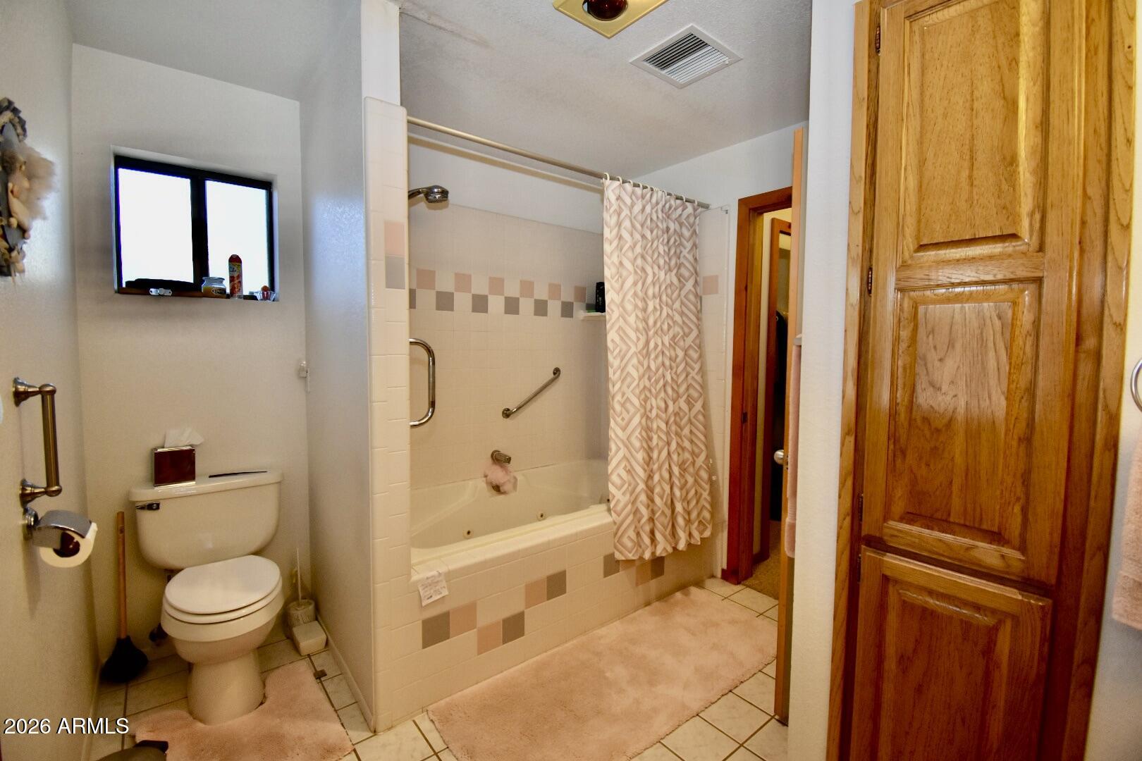 4310 North Lake View Drive Rimrock, AZ 86335 - Photo 18 of 43 a bathroom with a toilet and shower