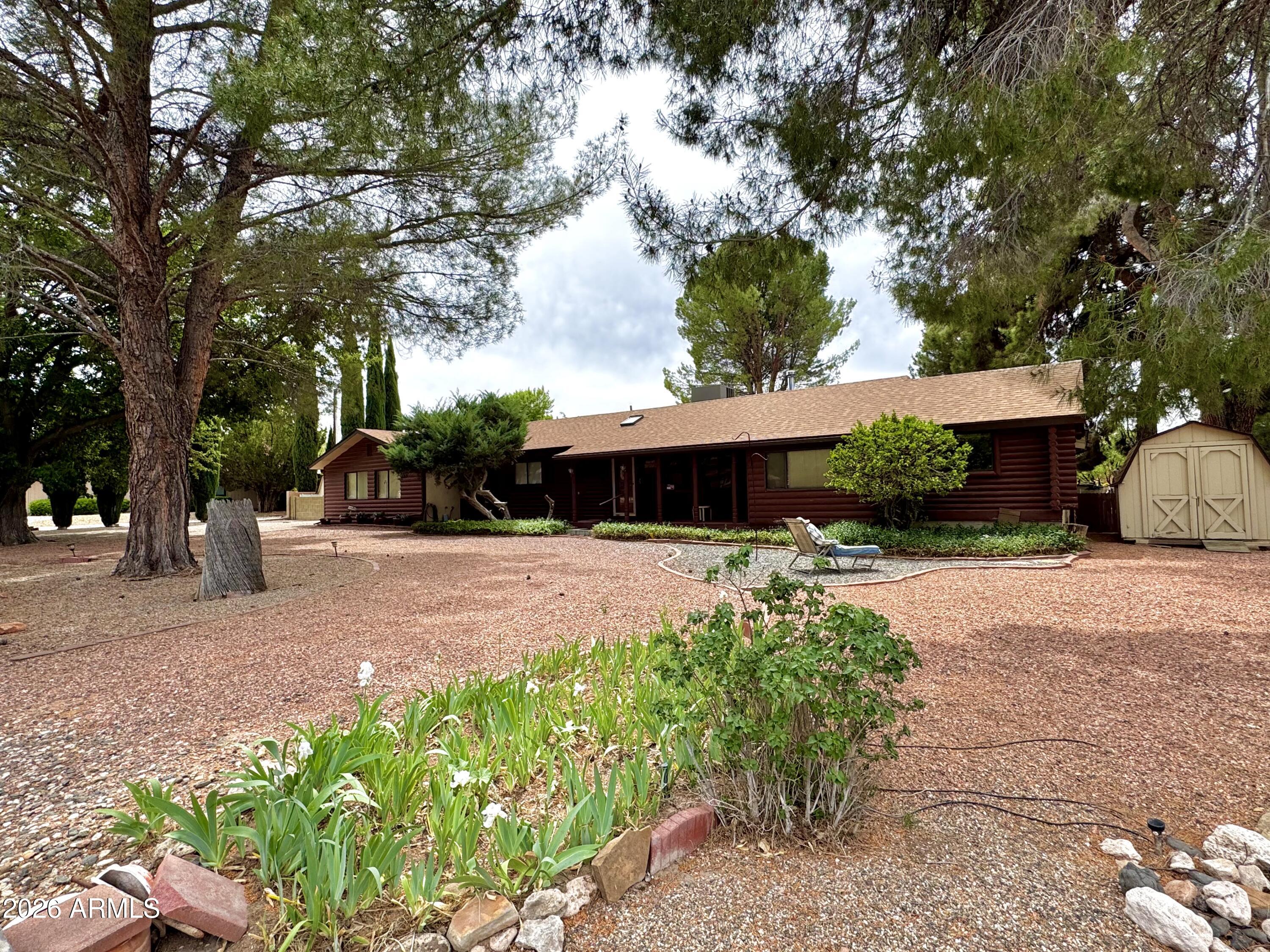 4310 North Lake View Drive Rimrock, AZ 86335 - Photo 43 of 43 a front view of a house with a yard and a garage