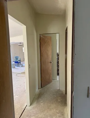 a view of a bathroom from a hallway