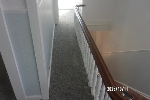 a view of an empty room and window