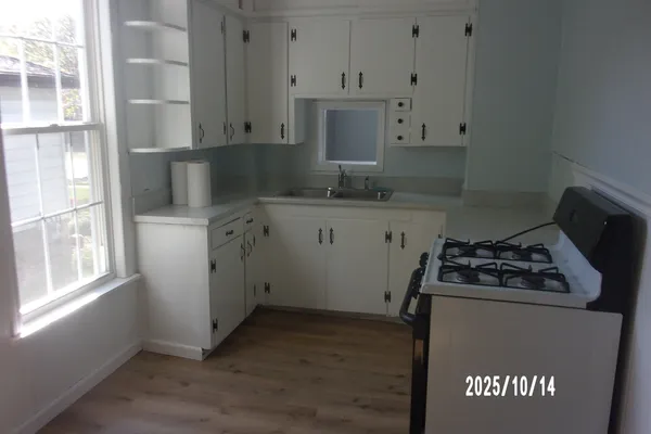 a view of an empty room with a window