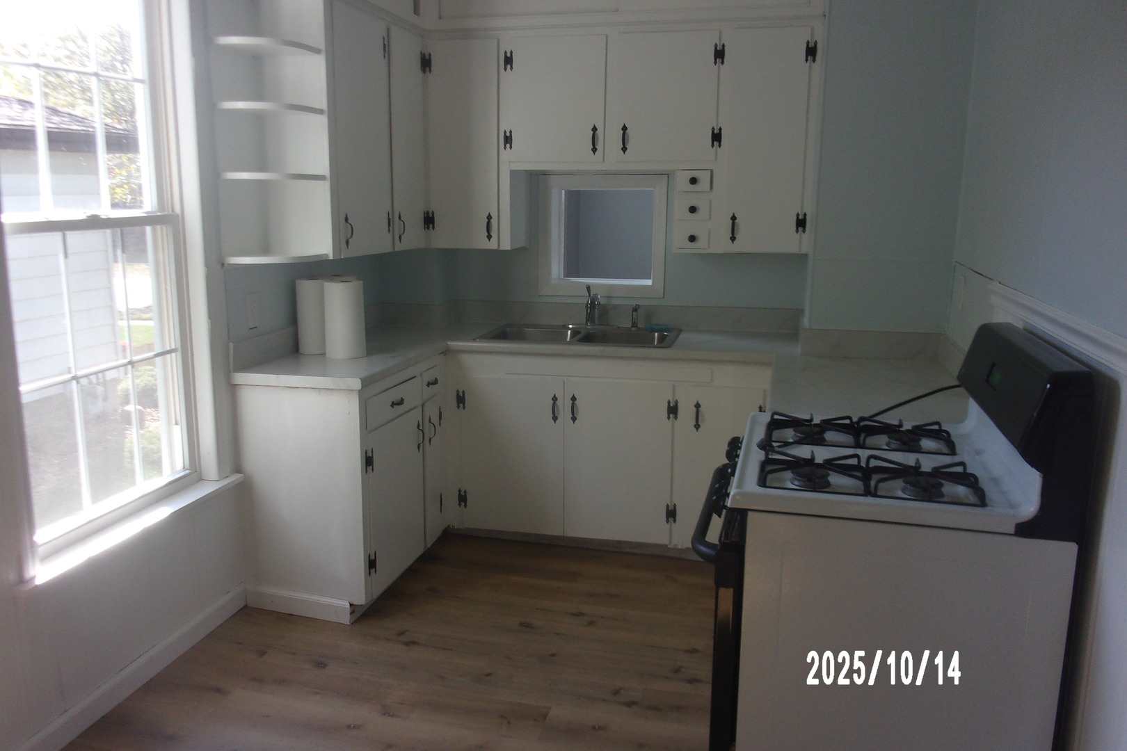 466 East Cherry Street Watseka, IL 60970 - Photo 22 of 25 a kitchen with granite countertop white cabinets and refrigerator
