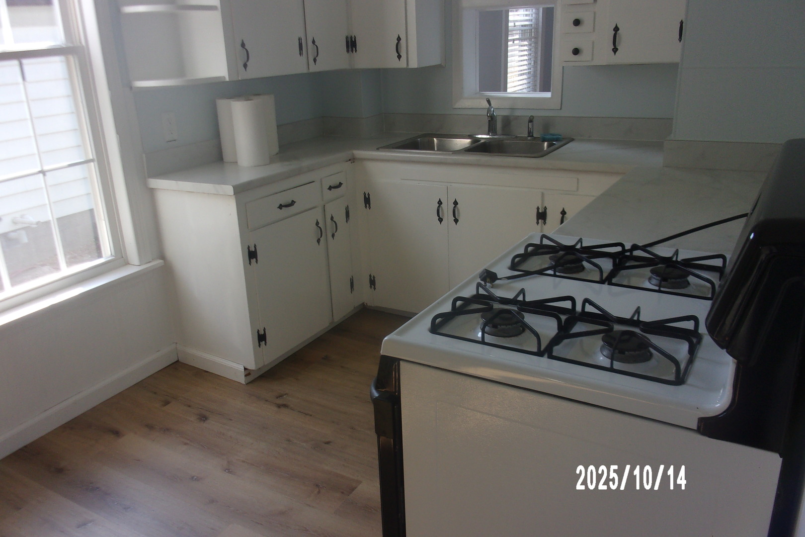 466 East Cherry Street Watseka, IL 60970 - Photo 23 of 25 a kitchen with a sink stove and cabinets