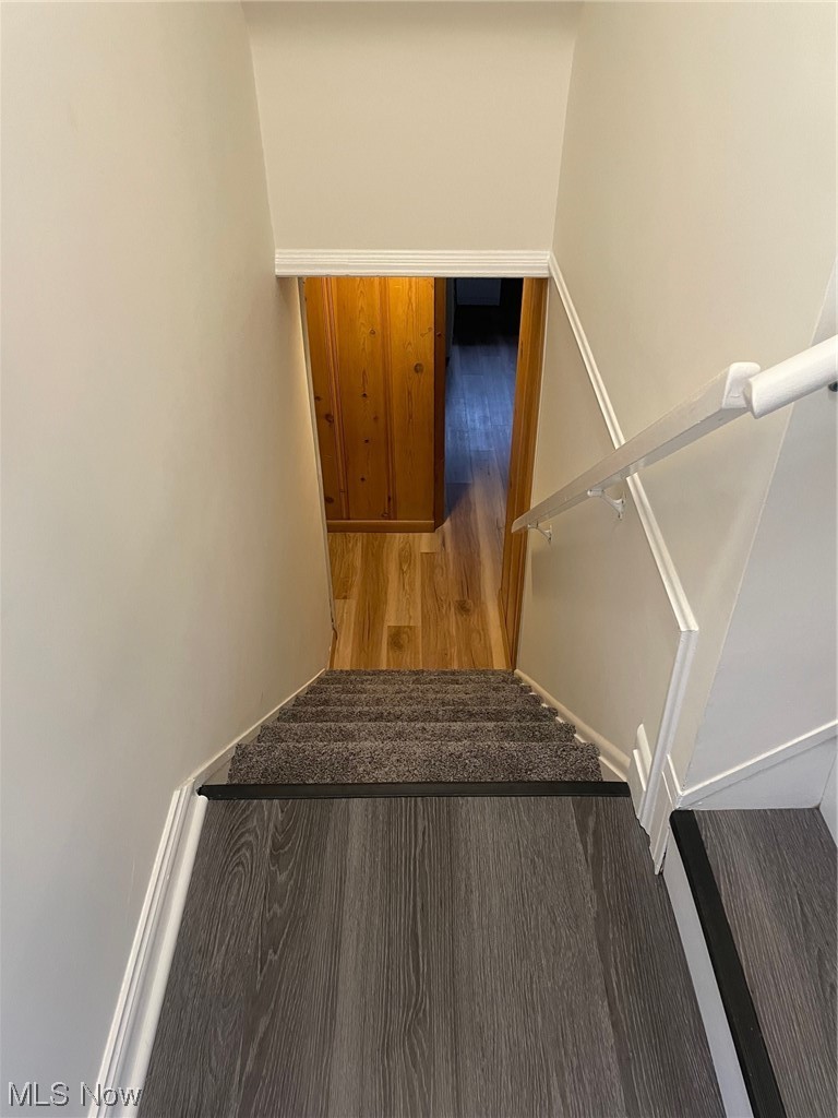 5972 Crossview Road Independence, OH 44131 - Photo 17 of 33 Stairs featuring hardwood / wood-style flooring