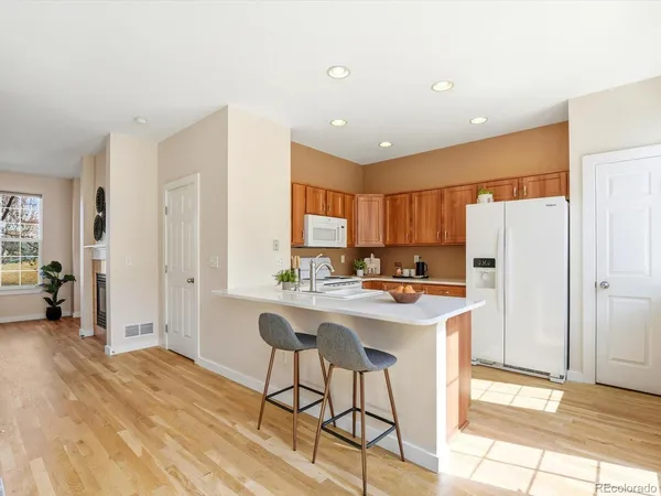 a kitchen with a sink a stove and a refrigerator