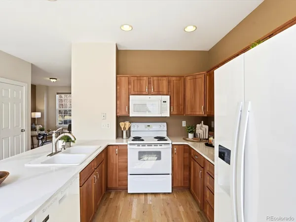 a stove top oven sitting inside of a kitchen