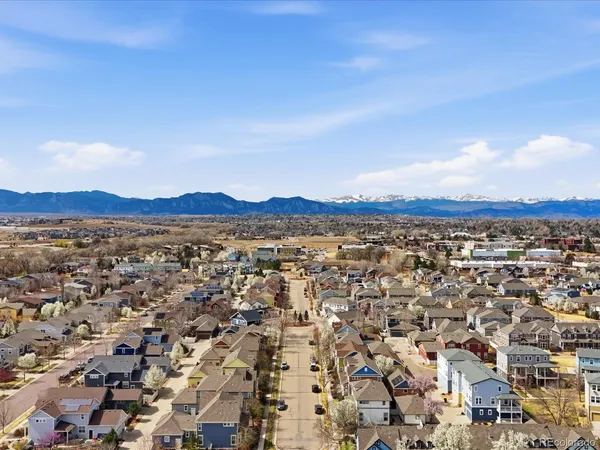 an aerial view of residential house and sandy dunes