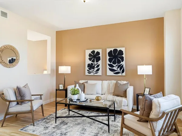 a living room with furniture and a table