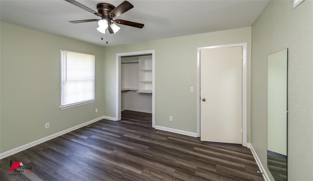 3109 Gorton Road Shreveport, LA 71119 - Photo 15 of 31 a view of an empty room with window and wooden floor
