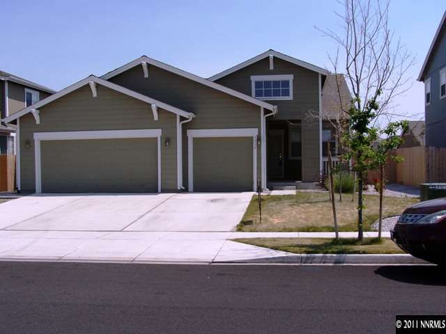 8946 Wynne Street Reno, NV 89506 - Photo 1 of 10 a front view of a house with a garage
