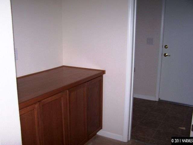 8946 Wynne Street Reno, NV 89506 - Photo 9 of 10 an empty room with wooden floor