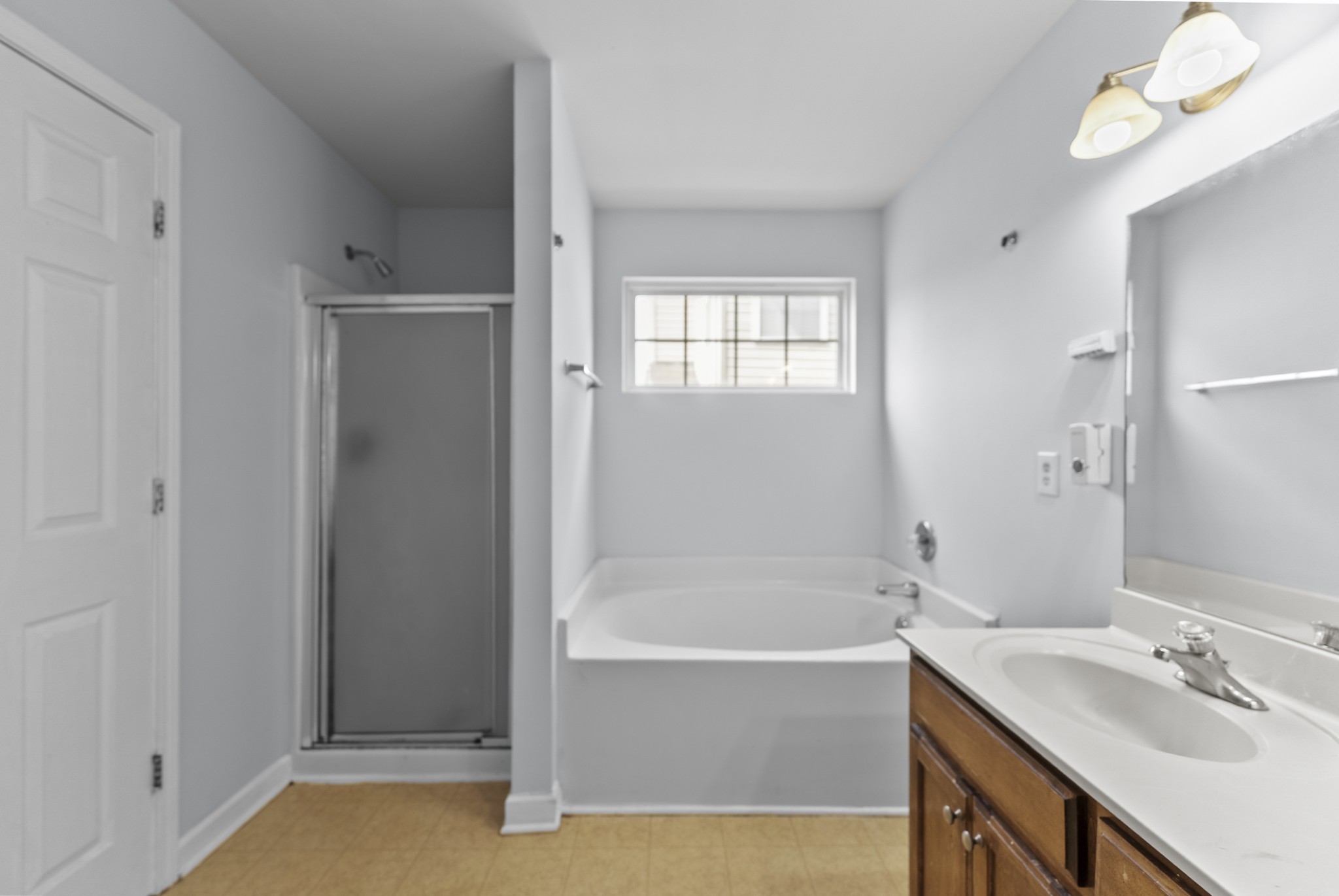 2849 Evergreen Ridge Point Nashville, TN 37217 - Photo 13 of 31 a bathroom with a tub sink and mirror