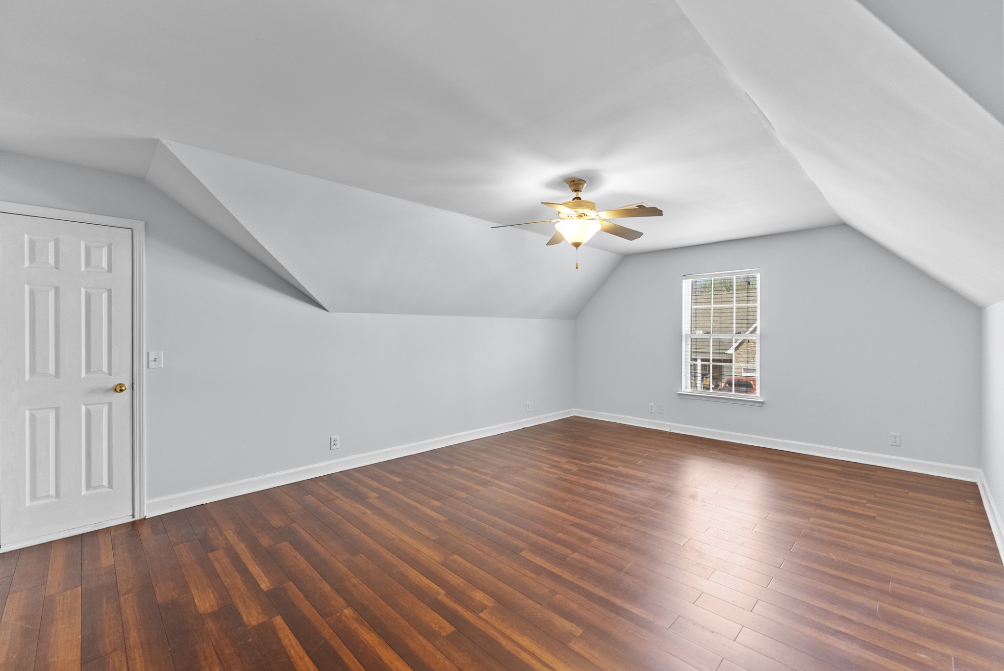 2849 Evergreen Ridge Point Nashville, TN 37217 - Photo 19 of 31 a view of an empty room with wooden floor and a window