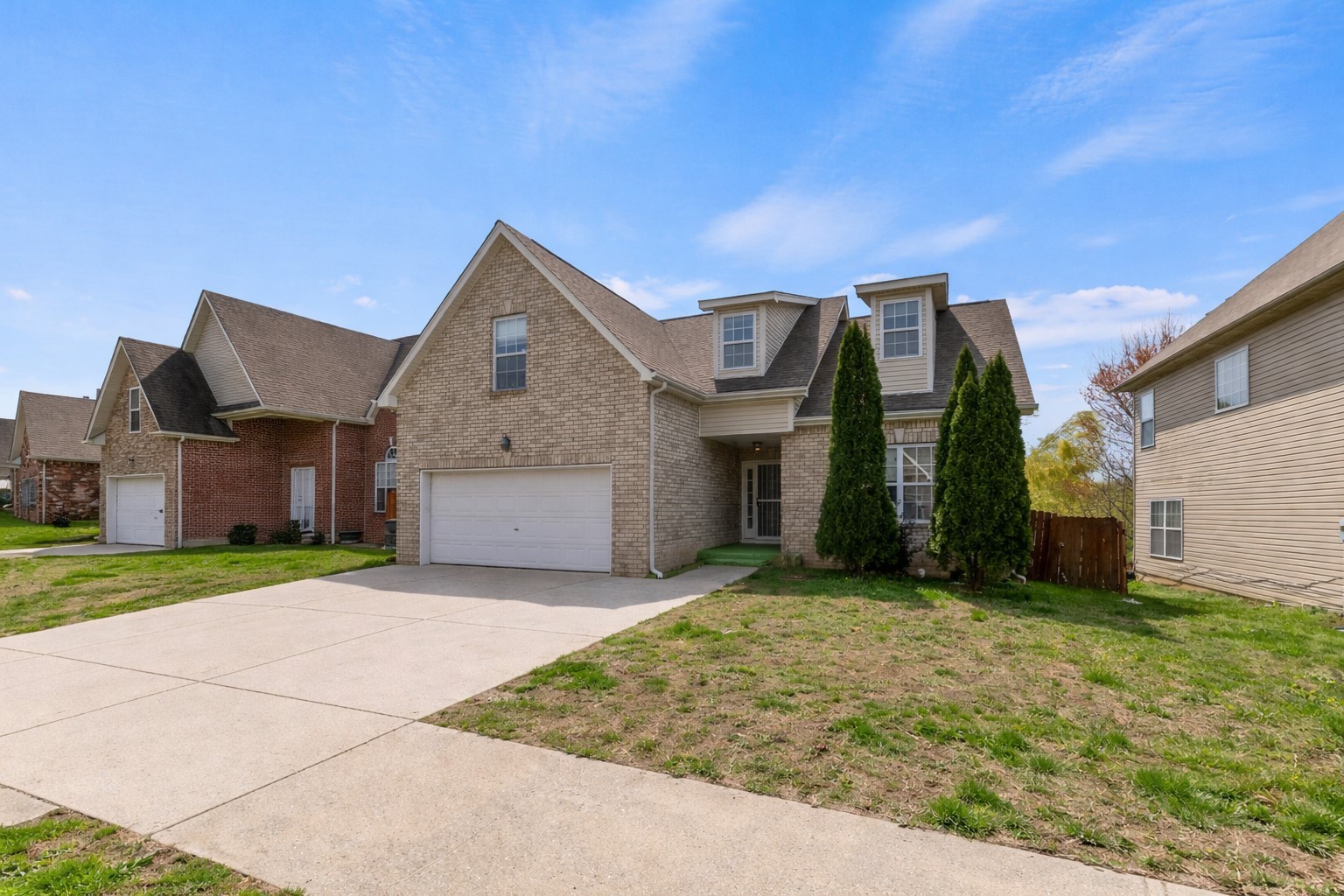2849 Evergreen Ridge Point Nashville, TN 37217 - Photo 2 of 31 a front view of a house with a yard and garage