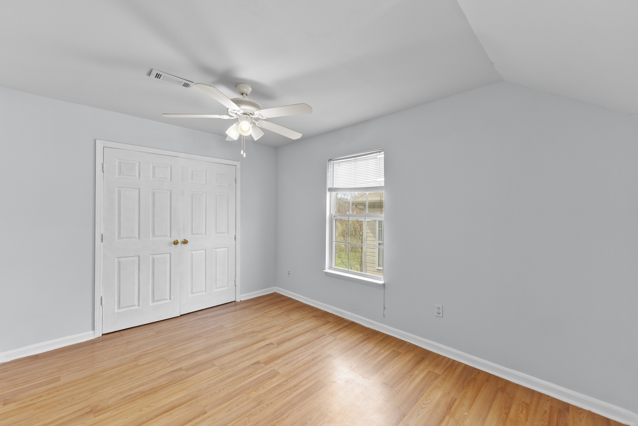 2849 Evergreen Ridge Point Nashville, TN 37217 - Photo 22 of 31 an empty room with wooden floor chandelier fan and windows