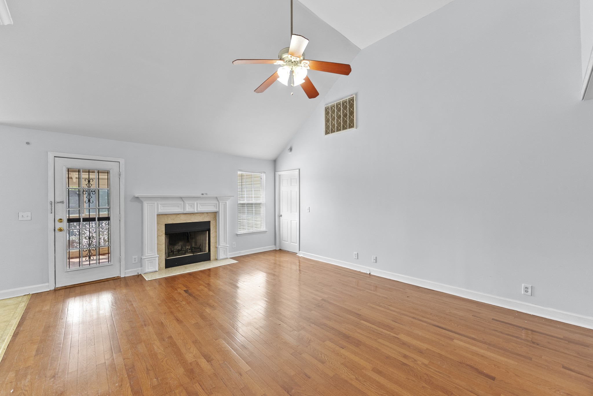2849 Evergreen Ridge Point Nashville, TN 37217 - Photo 5 of 31 a view of an empty room with wooden floor fireplace and a window