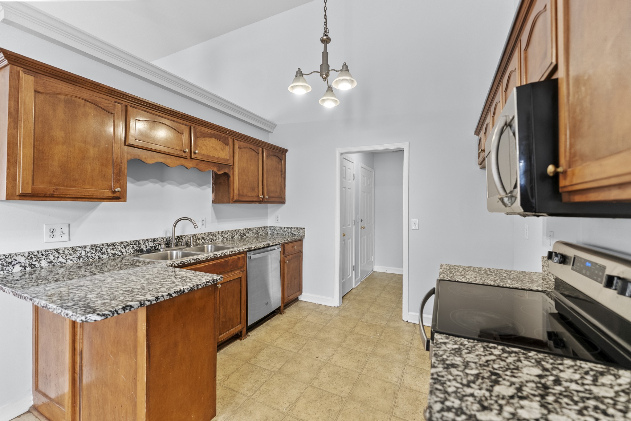 2849 Evergreen Ridge Point Nashville, TN 37217 - Photo 7 of 31 a kitchen with stainless steel appliances granite countertop a sink stove and refrigerator