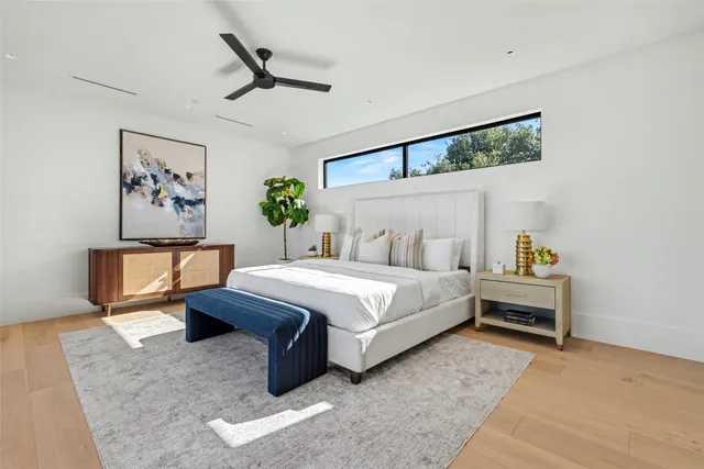 a bathroom with a tub shower and sink