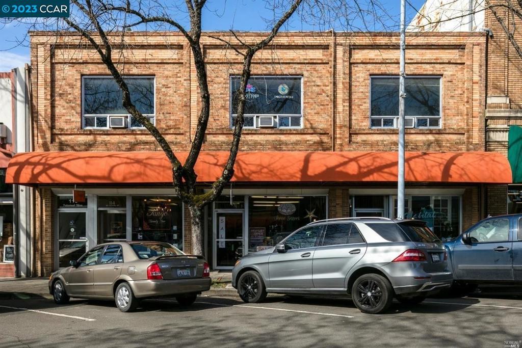 a view of a car parked in front of a building