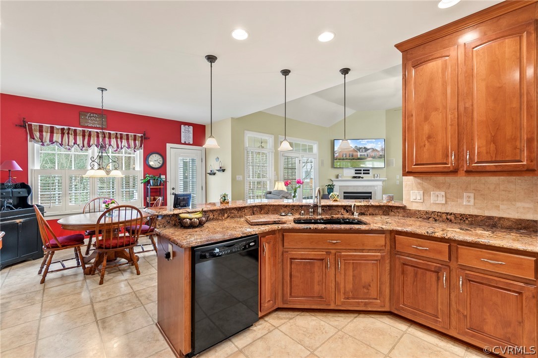 847 Club Ridge Terrace Chester, VA 23836 - Photo 11 of 35 a kitchen with stainless steel appliances granite countertop wooden cabinets a stove a sink and a microwave