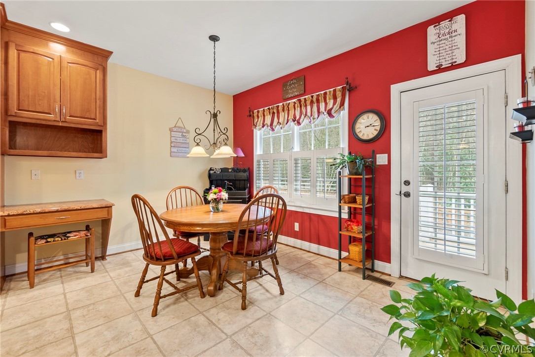847 Club Ridge Terrace Chester, VA 23836 - Photo 14 of 35 a dinning area with a table and chairs