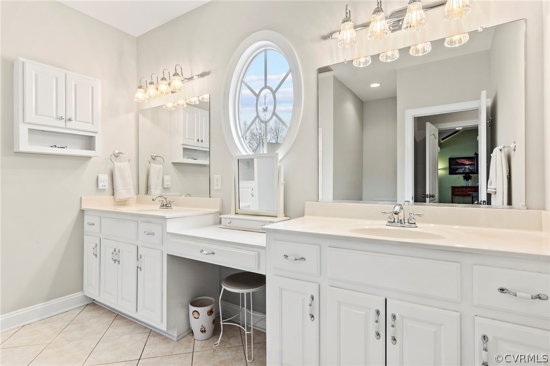 847 Club Ridge Terrace Chester, VA 23836 - Photo 29 of 35 a spacious bathroom with a sink a mirror and a large mirror