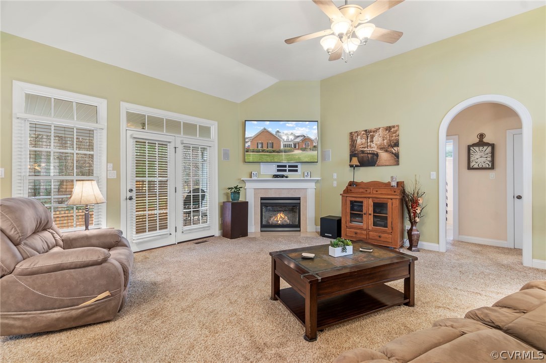 847 Club Ridge Terrace Chester, VA 23836 - Photo 4 of 35 a living room with furniture a fireplace and a flat screen tv