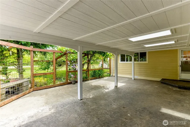 a view of an empty room with sliding glass door