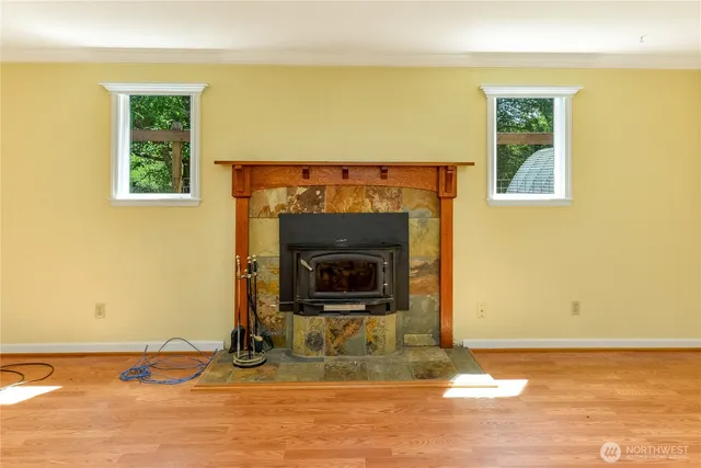 a living room with a fireplace and a fireplace