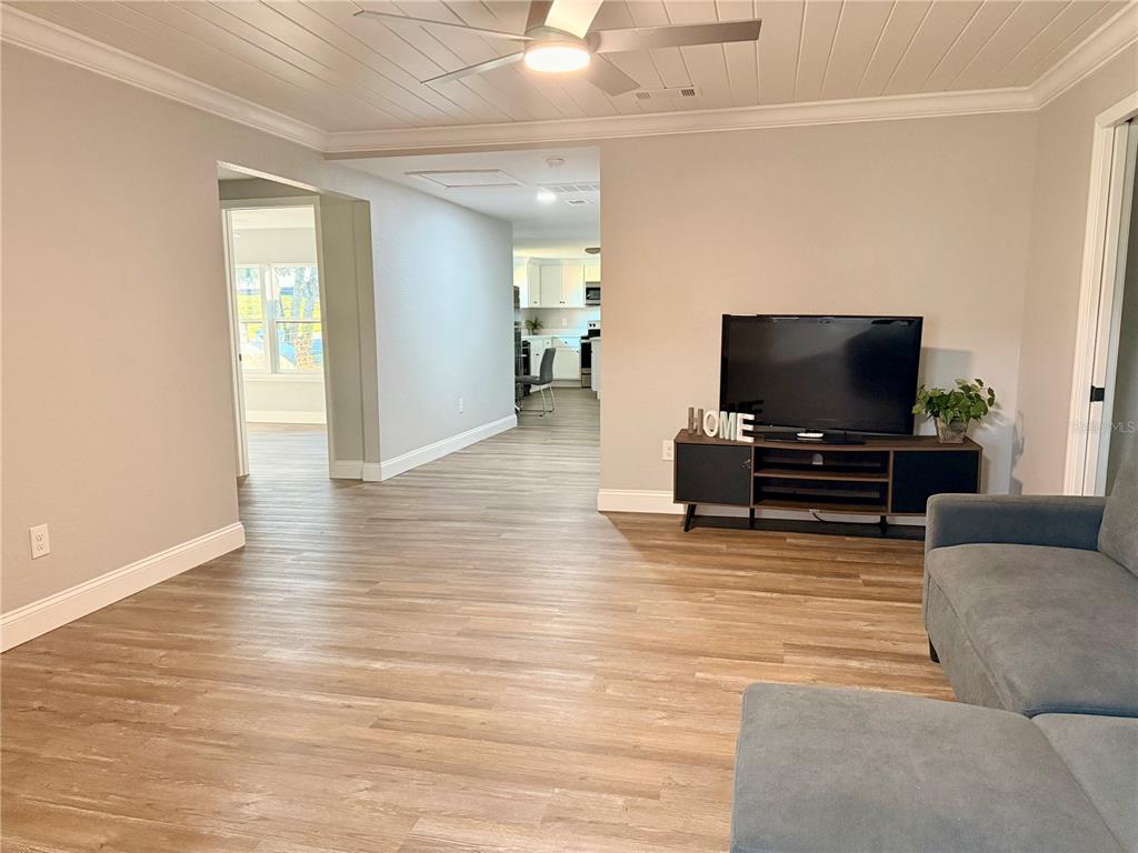 111 Water Tank Road Haines City, FL 33844 - Photo 13 of 48 a living room with furniture and a flat screen tv