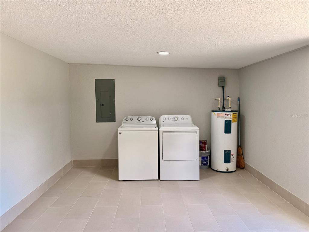 111 Water Tank Road Haines City, FL 33844 - Photo 29 of 48 a utility room with dryer and washer