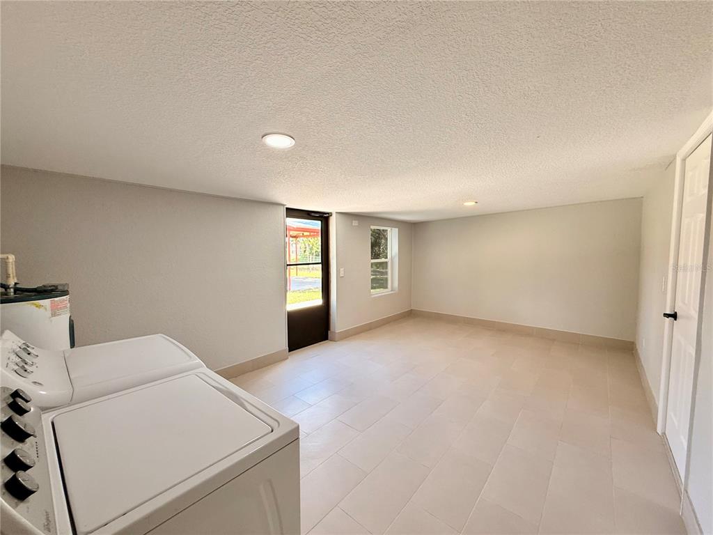 111 Water Tank Road Haines City, FL 33844 - Photo 30 of 48 a view of an empty room with a window