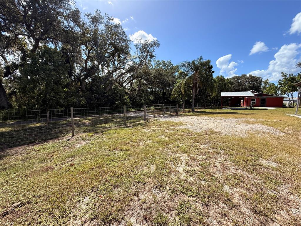 111 Water Tank Road Haines City, FL 33844 - Photo 33 of 48 a view of swimming pool with outdoor seating and yard in back
