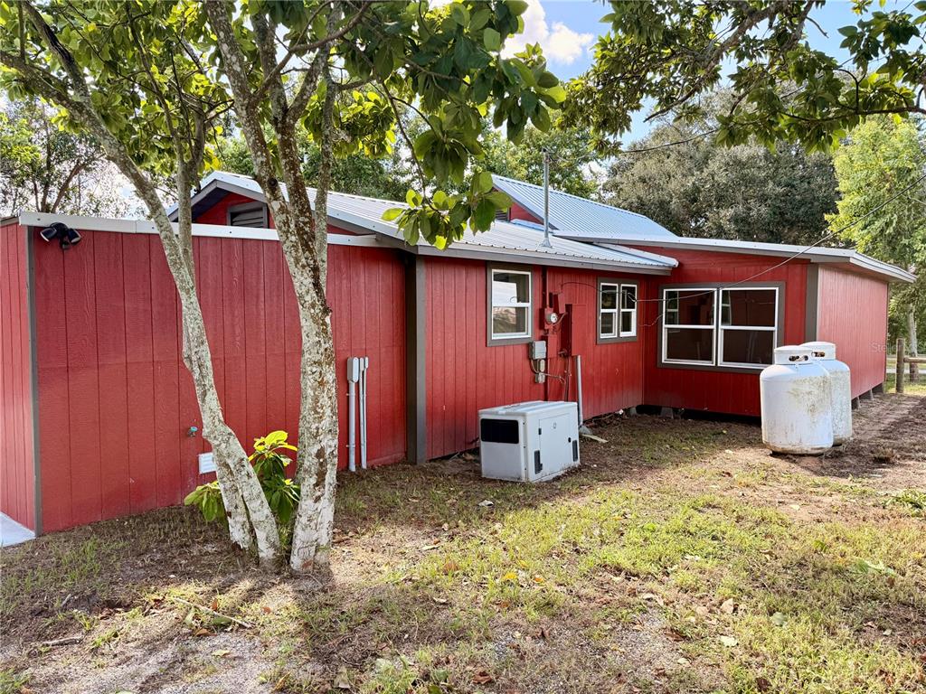 111 Water Tank Road Haines City, FL 33844 - Photo 37 of 48 a front view of a house with garden