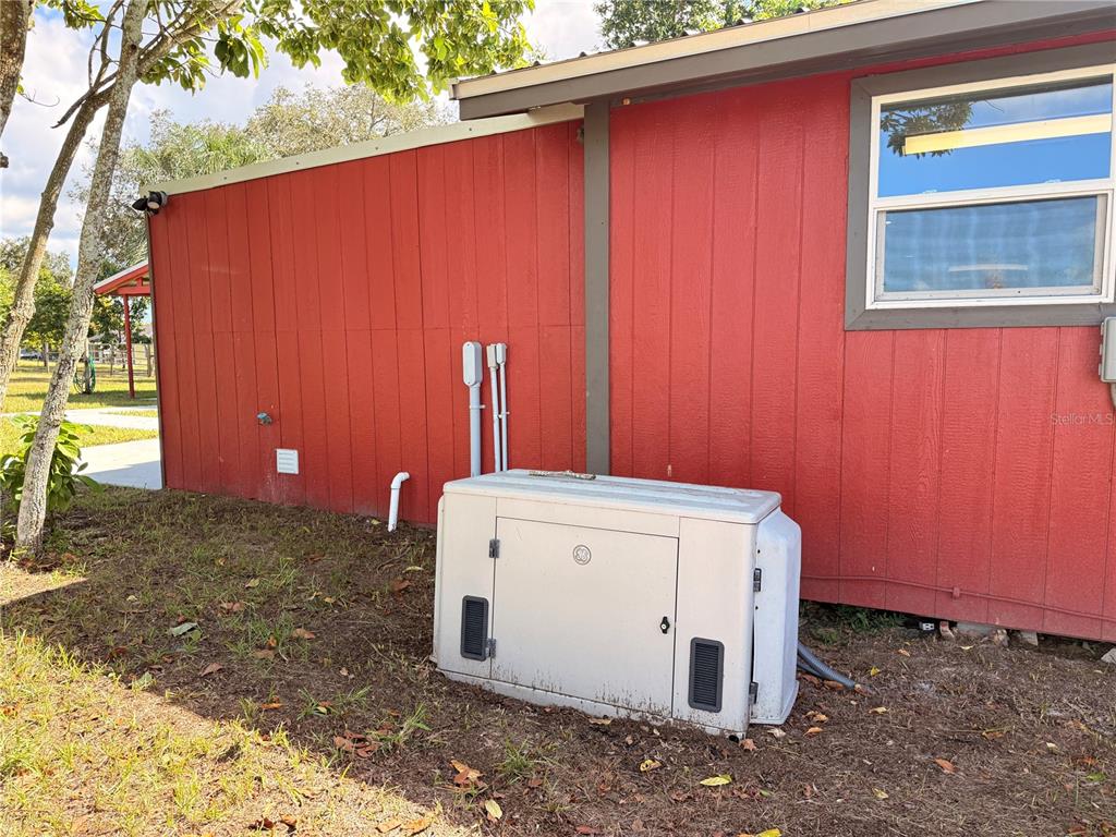 111 Water Tank Road Haines City, FL 33844 - Photo 38 of 48 a view of a utility room with washer and dryer