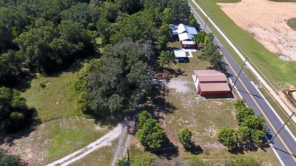 111 Water Tank Road Haines City, FL 33844 - Photo 40 of 48 an aerial view of house with yard