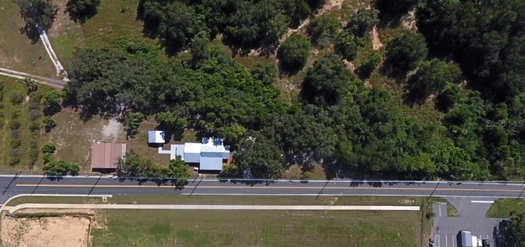 111 Water Tank Road Haines City, FL 33844 - Photo 46 of 48 an aerial view of a building with trees