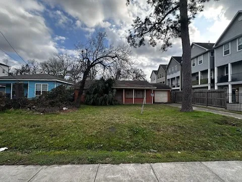 front view of a house with a garden