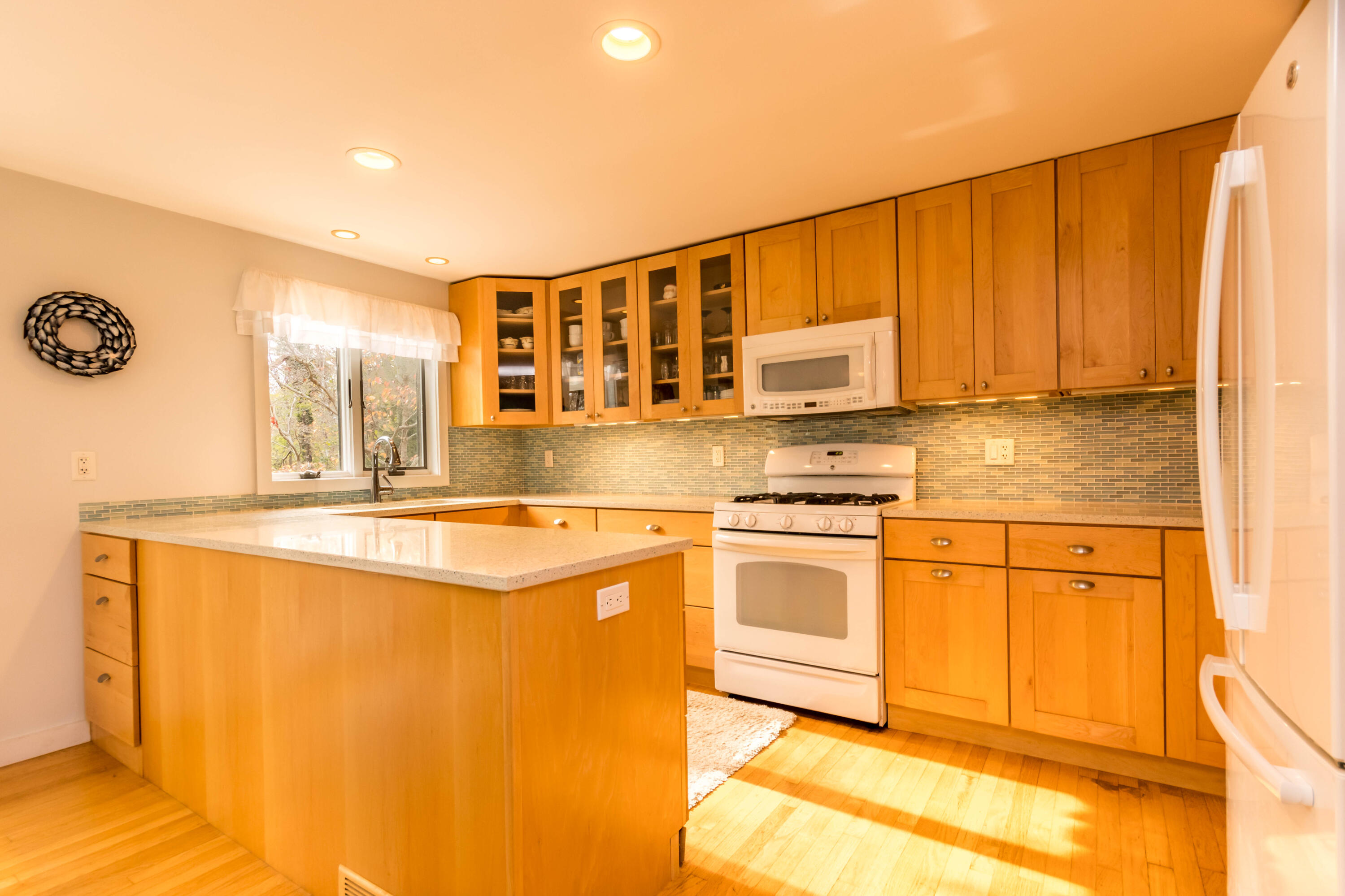 141 Long Pond Road Brewster, MA 02631 - Photo 5 of 58 Kitchen with granite & tile backspash