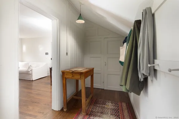 a view of a bedroom with furniture and staircase