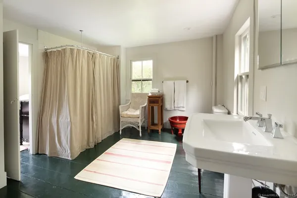 a view of a hallway with a flower pot