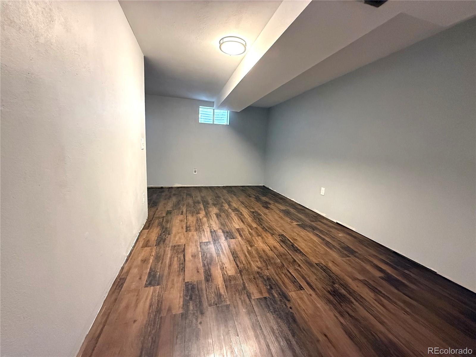 8905 Field Street, Unit 89 Broomfield, CO 80021 - Photo 17 of 18 a view of wooden floor in a hallway