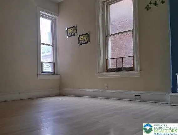 an empty room with windows