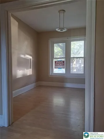 a view of an empty room with a window