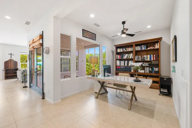 a work room with furniture and a book shelf