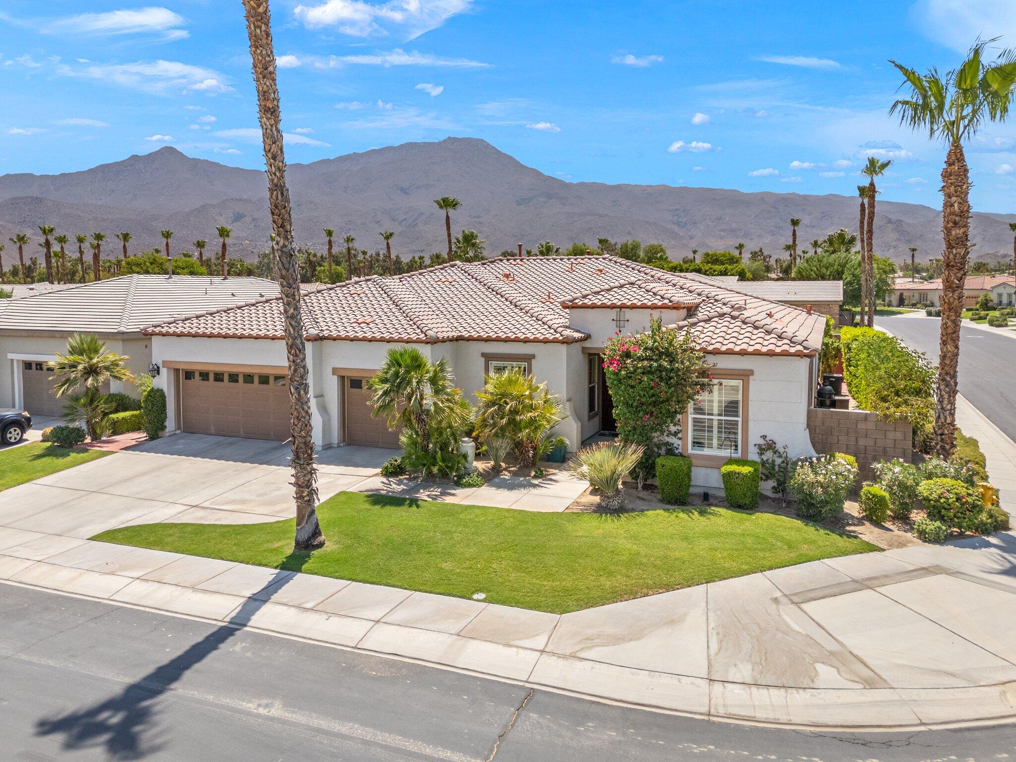 61185 Soaptree Drive La Quinta, CA 92253 - Photo 2 of 51 a front view of house with yard and green space