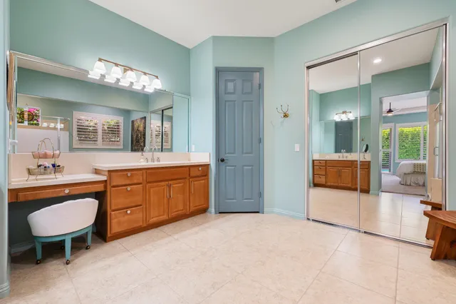 a bathroom with a sink a vanity and a mirror
