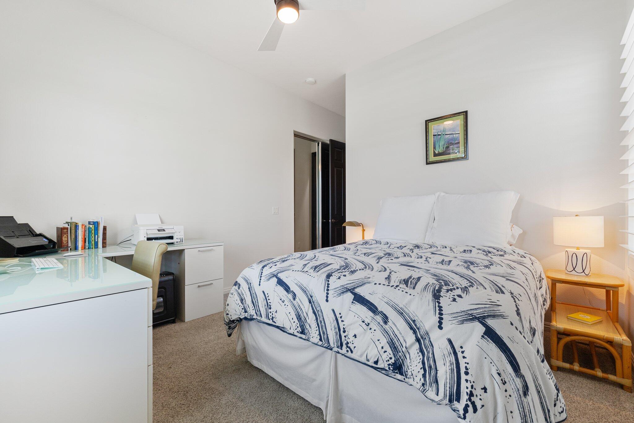 61185 Soaptree Drive La Quinta, CA 92253 - Photo 29 of 51 a bedroom with a bed and a table in it