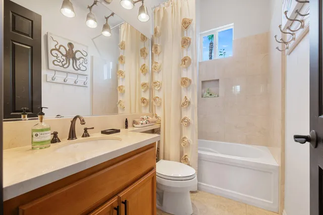 a bathroom with a sink a toilet and a bathtub